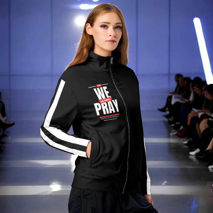 We Pray, God Delivers women's track jacketRevivalWear Brand Stay warm and trendy with this zip-up track jacket—perfect for workouts, outdoor activities, and everyday wear. It’s made from recycled materials, has brushed fleeceRevivalWear Brand Jacketswomen's track jacket